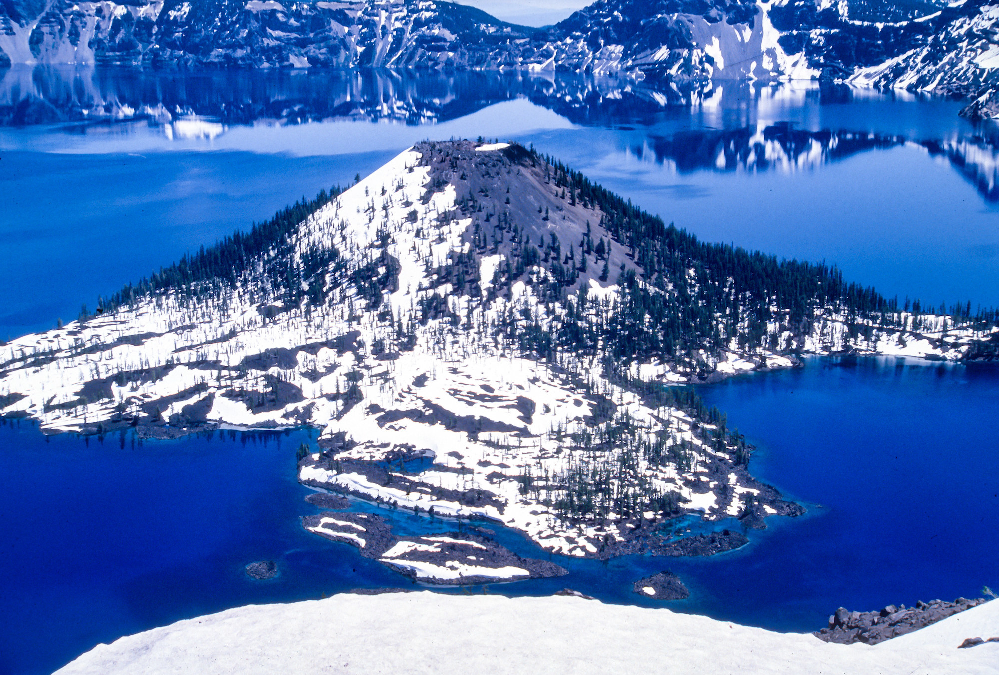 a mountain peak surrounded by water