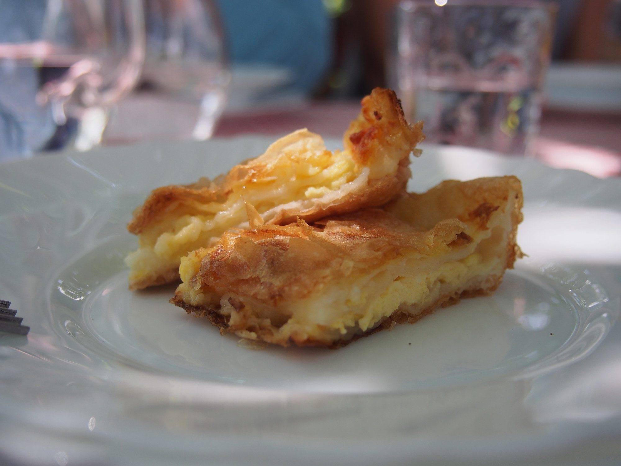 A piece of phyllo dough filled with soft cheeses.