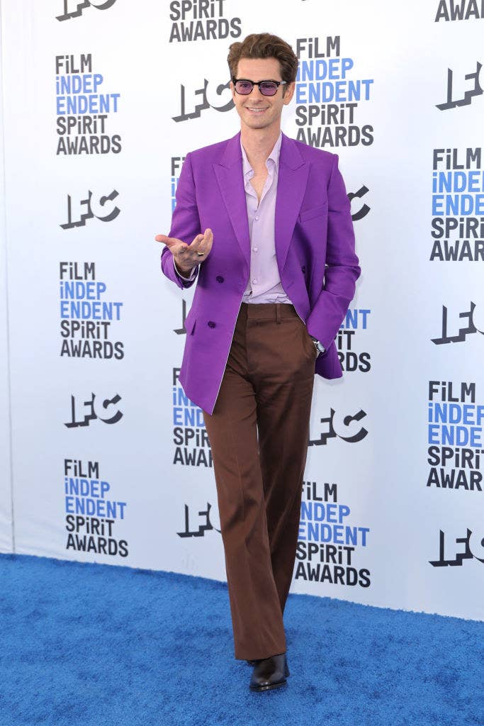 Andrew gesturing at the photographers at the Independent Spirit Awards while rocking tinted sunglasses