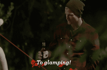 GIF of Jimmy Nicholson from The Bachelor Australia raising a beer and saying &quot;to glamping!&quot;