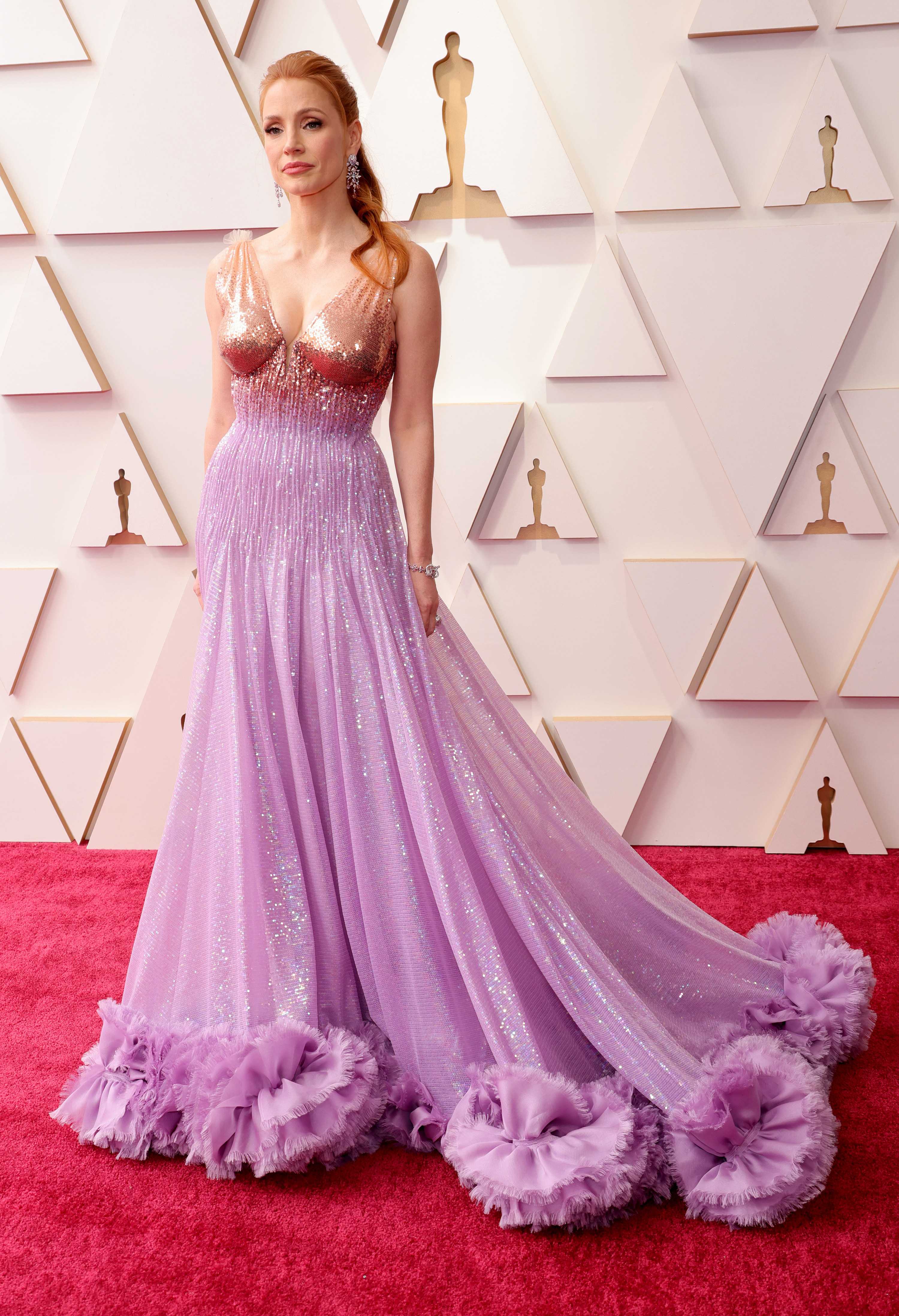 Jessica wearing a purple and gold sparkling gown