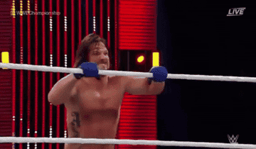 Roman Reigns spears AJ Styles out of the air