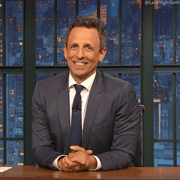Seth Meyers gesturing as if to say &quot;well?&quot;