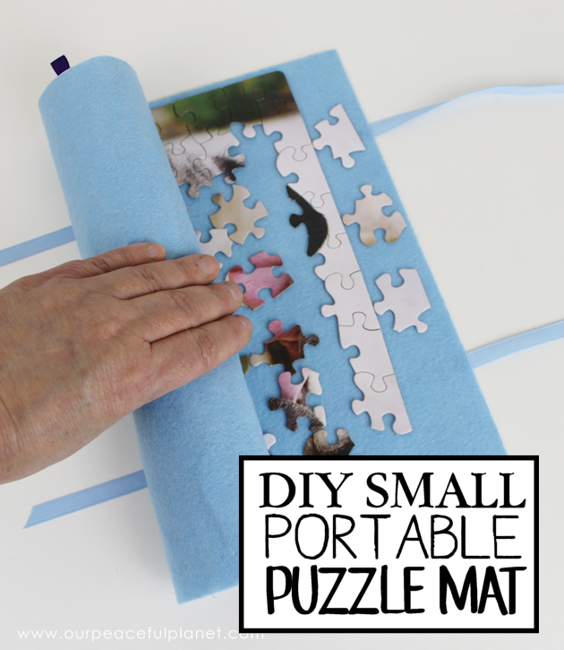 Blogger&#x27;s photo of a hand unrolling the DIY puzzle mat