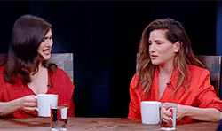 Kathryn Hahn and Rachel Weisz clinking mugs