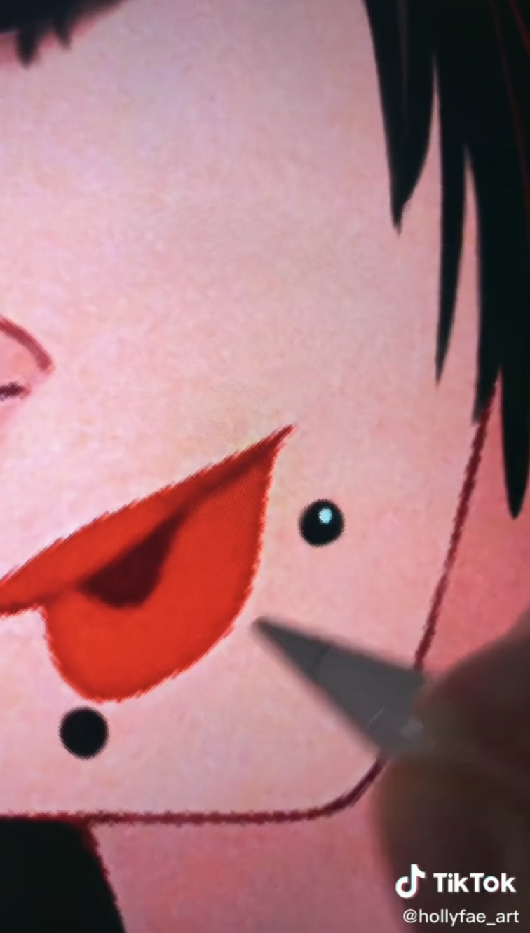 The artist adding small round piercings under Ariel&#x27;s lip