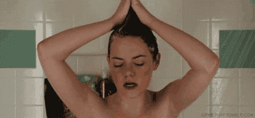 Gif of Emma Stone in &quot;Easy A&quot; singing in the shower