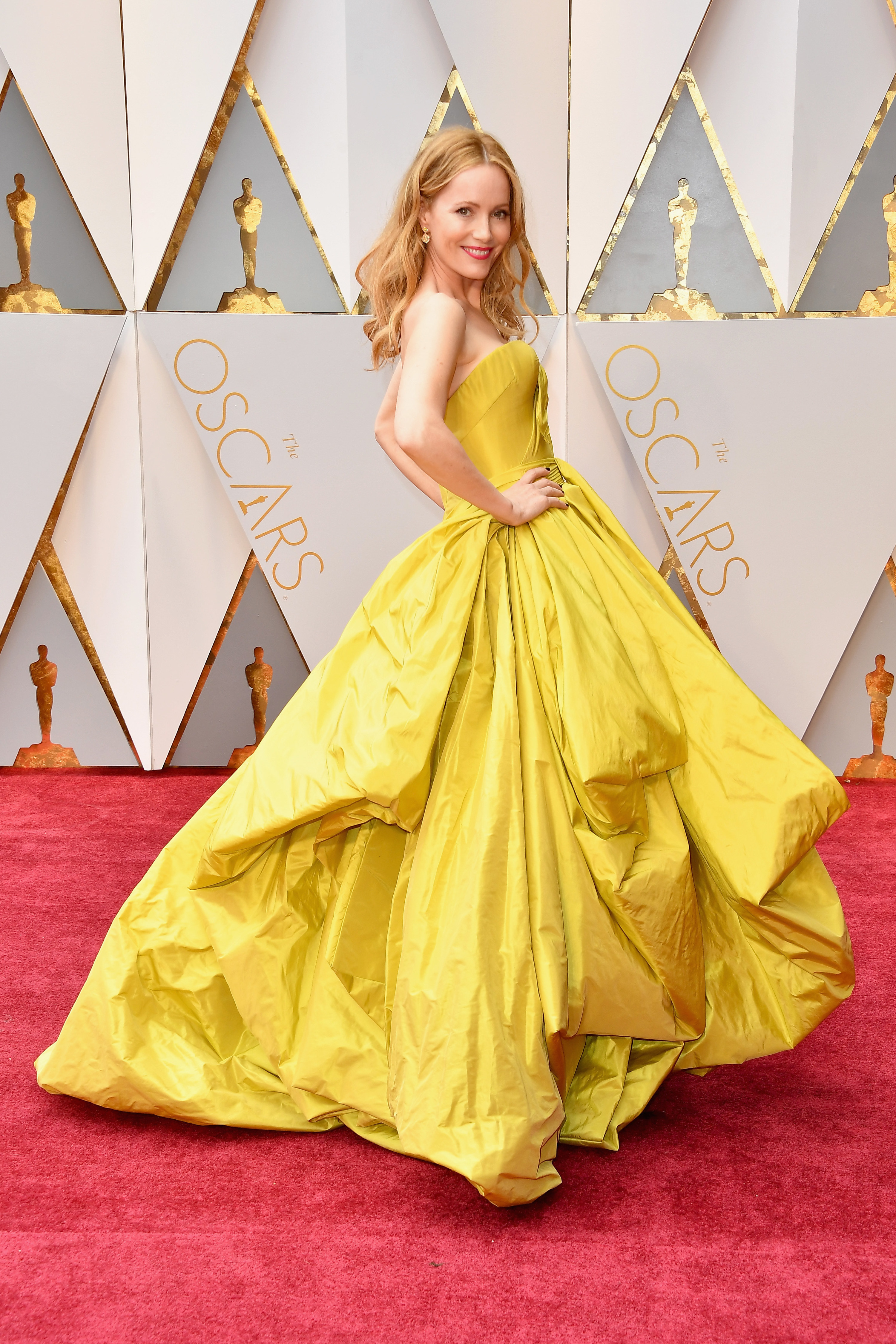 Leslie wearing a bright mustard-colored gown