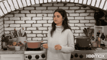 Selena Gomez doing a chef&#x27;s kiss in the kitchen
