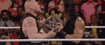 Roman Reigns and Brock Lesnar fight over WWE belt