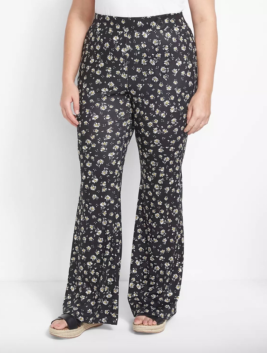 model wearing the pants in black with white flowers
