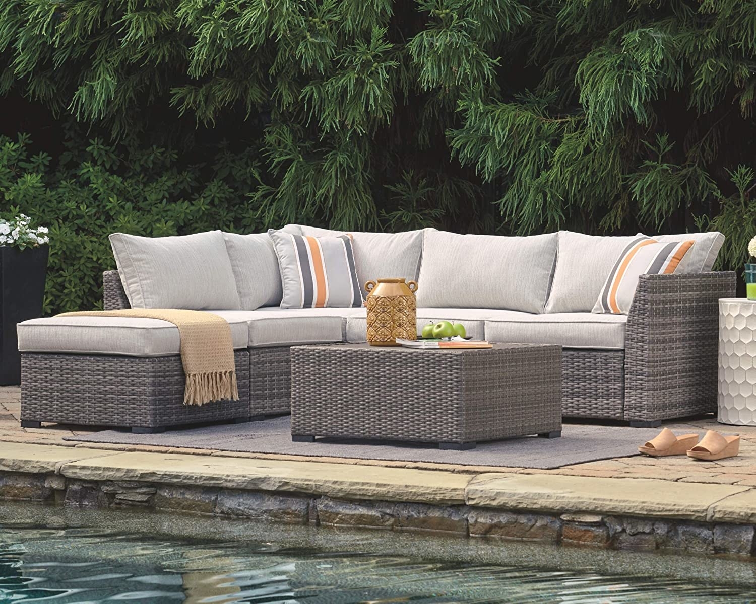 the four-piece set with couch, sectional ottomans, and side table