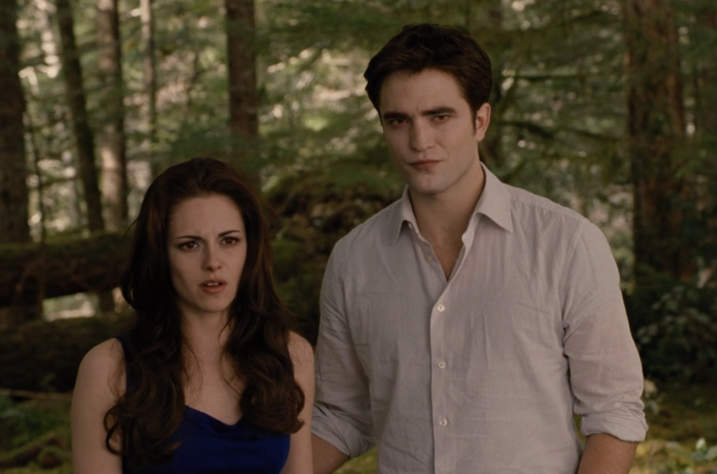 Robert Pattinson in the woods with Kristen Stewart