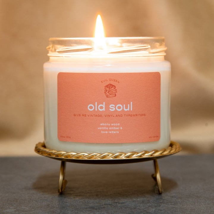 a glass candle that says "old soul" on it