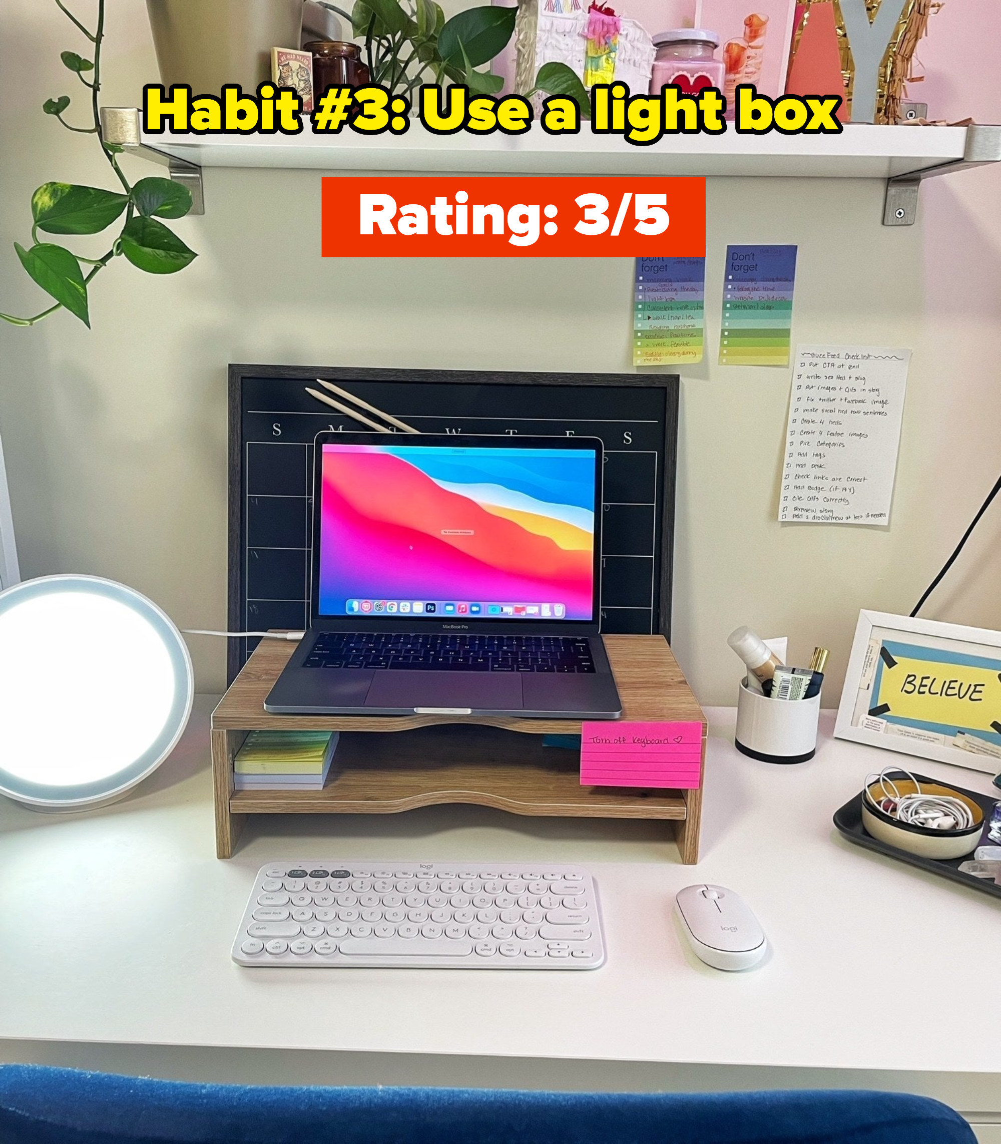 A light box on a desk with a computer