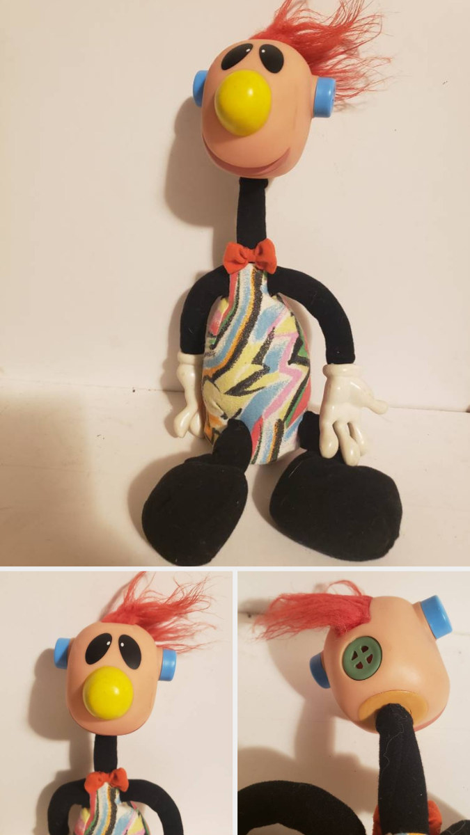 A Jibba Jabber doll with red hair and a yellow nose