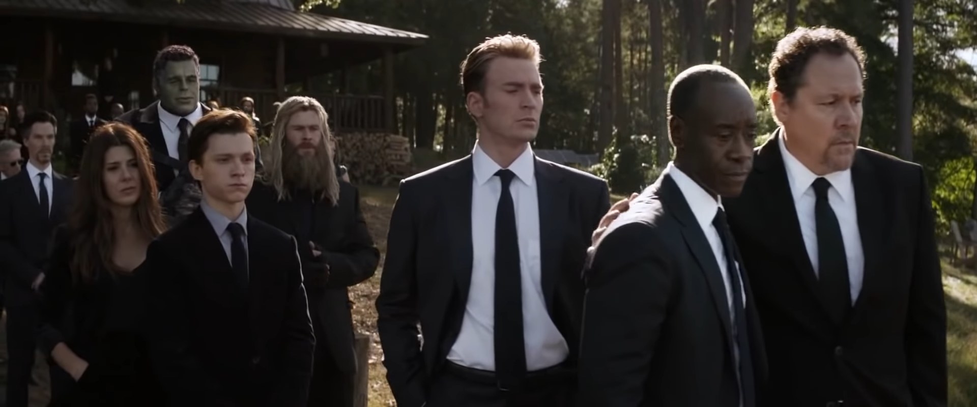 Left to right: Doctor Strange, Aunt May, the Hulk, Peter Parker, Thor, Steve Rogers, Rhodey, and Happy at Tony's funeral in "Avengers: Endgame"