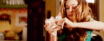 Rebecca from Confessions of a Shopaholic breaking a credit card out of a chunk of ice