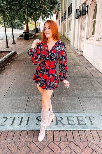 a different reviewer wearing the  black and red floral romper
