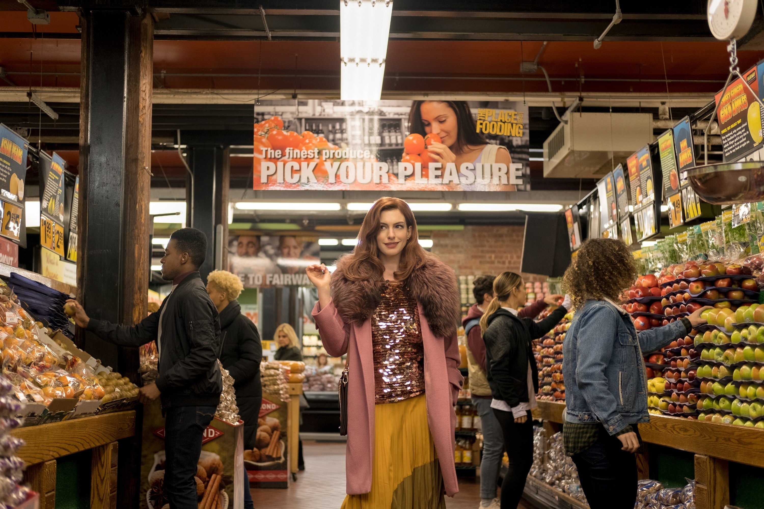 Anne Hathaway walks through a supermarket