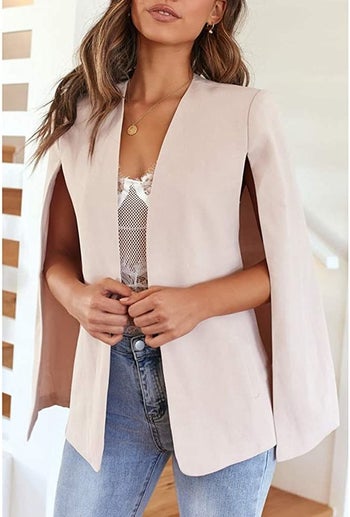 the pink cape over a white top and jeans