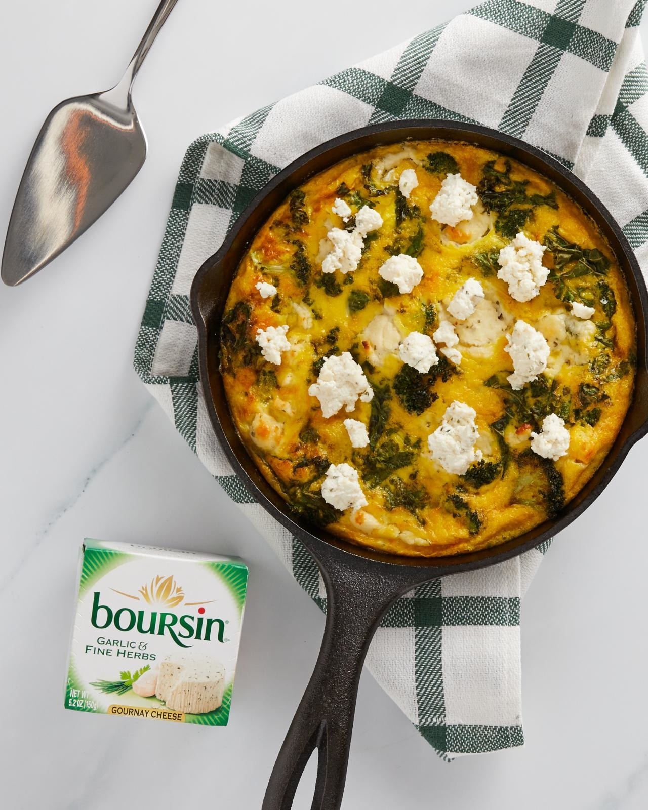 Pan with broccoli and kale frittata topped with Boursin® Cheese
