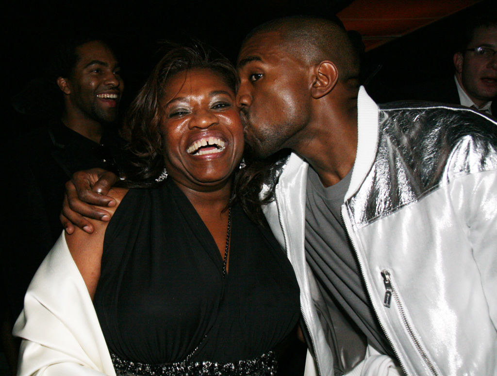 Kanye West kissing his mother on the cheek