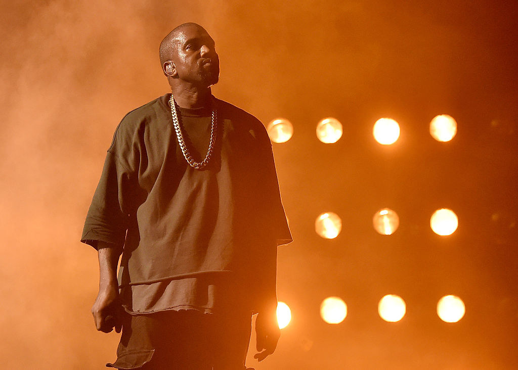 Kanye West performs onstage at the 2015 iHeartRadio Music Festival