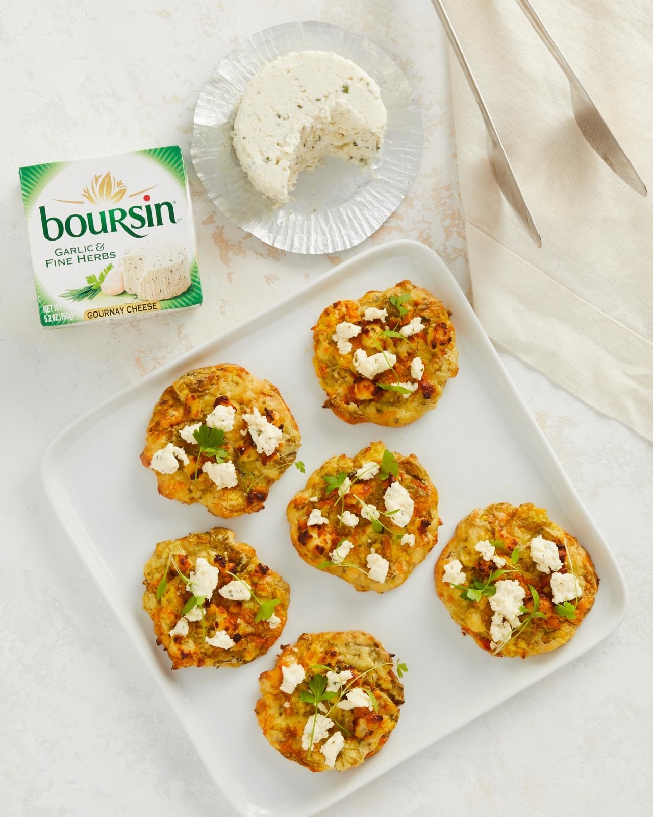 Plate with six fritters topped with Boursin® Cheese