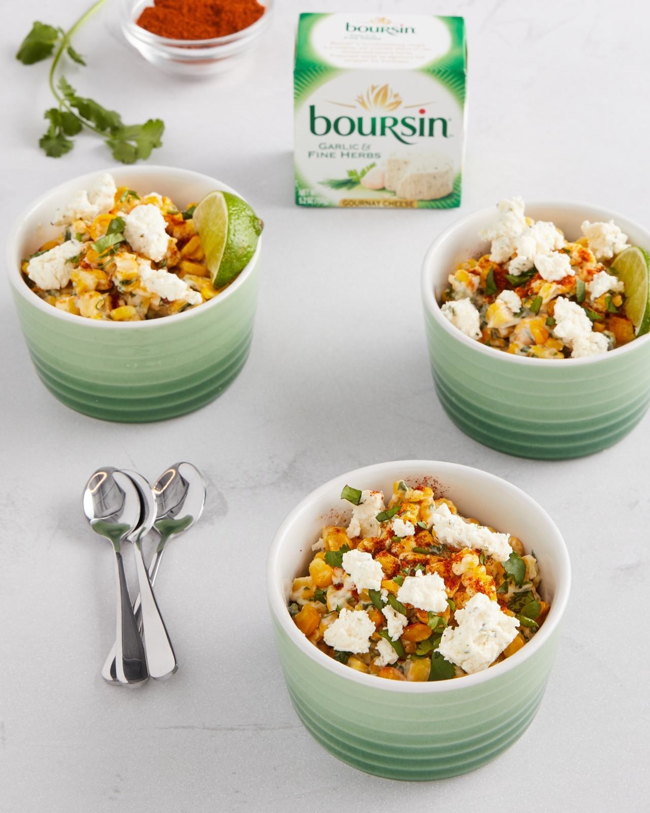 Three bowls with esquites and crumbled Bousin cheese