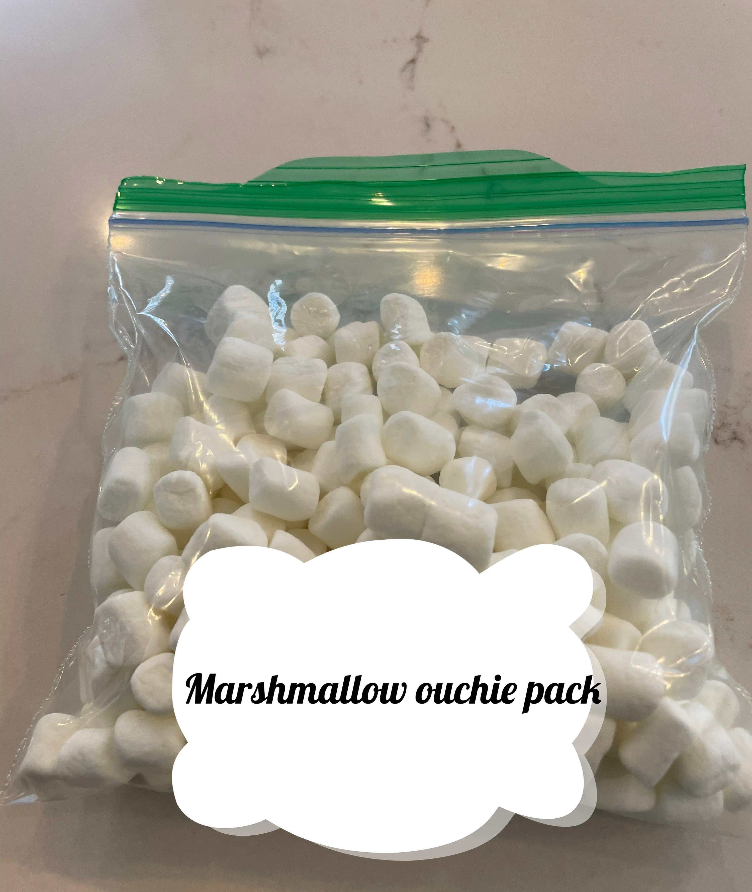 A photo of frozen marshmallows in a Ziploc bag