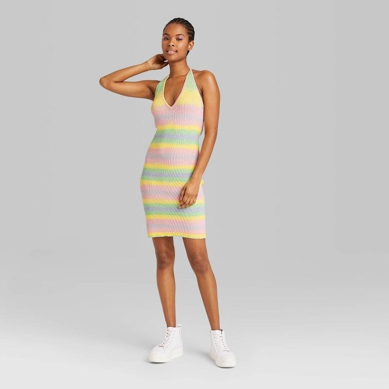 model wearing multi colored dress, stops mid thigh