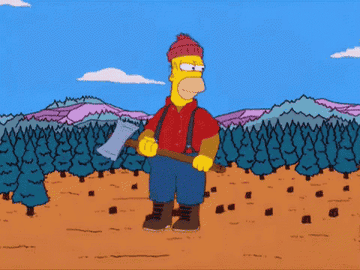 A giant Homer Simpson runs along stomping on regular sized peoples log cabins