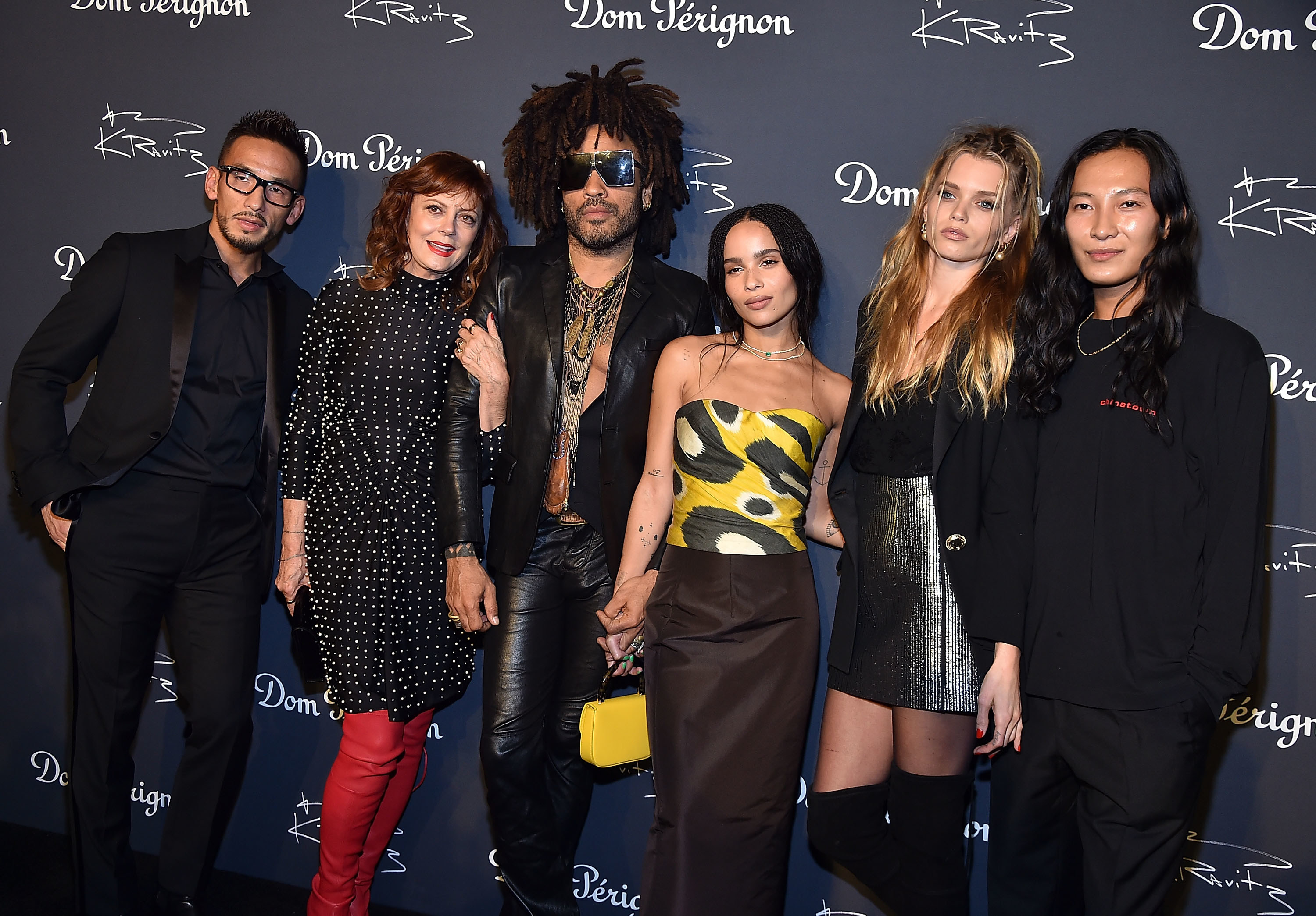 Zoe poses with a group of people that includes her dad, Lenny Kravitz and Alexander Wang