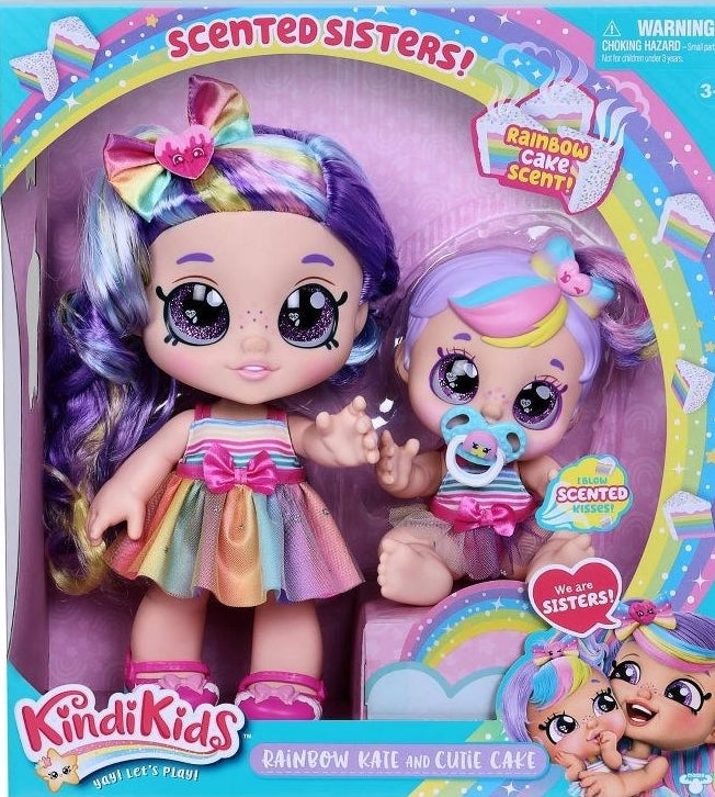 the two dolls in their packaging