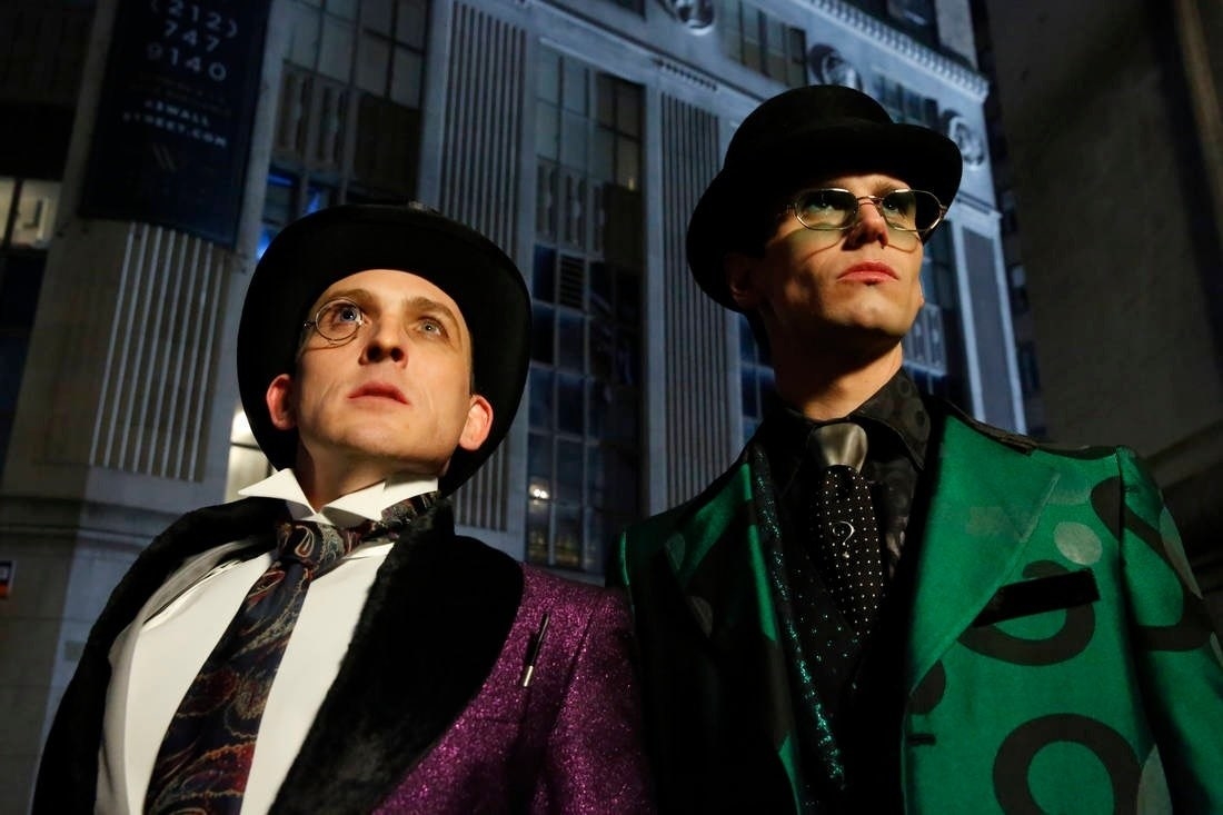 Penguin and Riddler looking up at something off camera