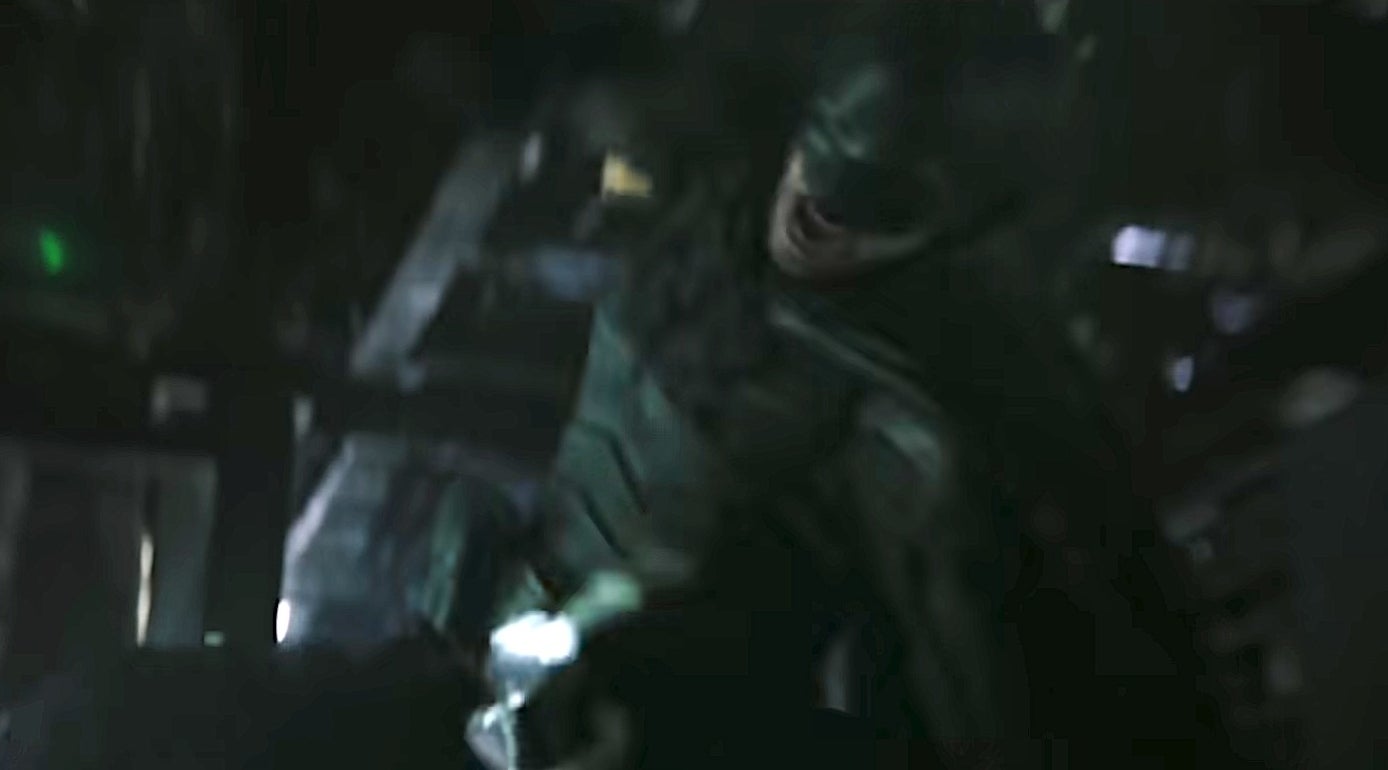 Batman punching one of Riddler&#x27;s henchmen in &quot;The Batman&quot;