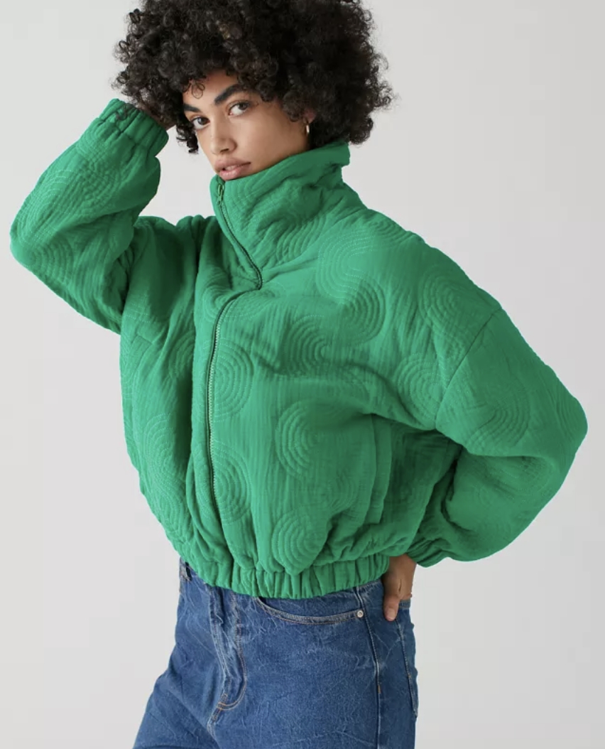 a person wearing the quilted cropped bomber jacket
