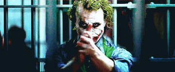 Heath Ledger slow clapping as the Joker