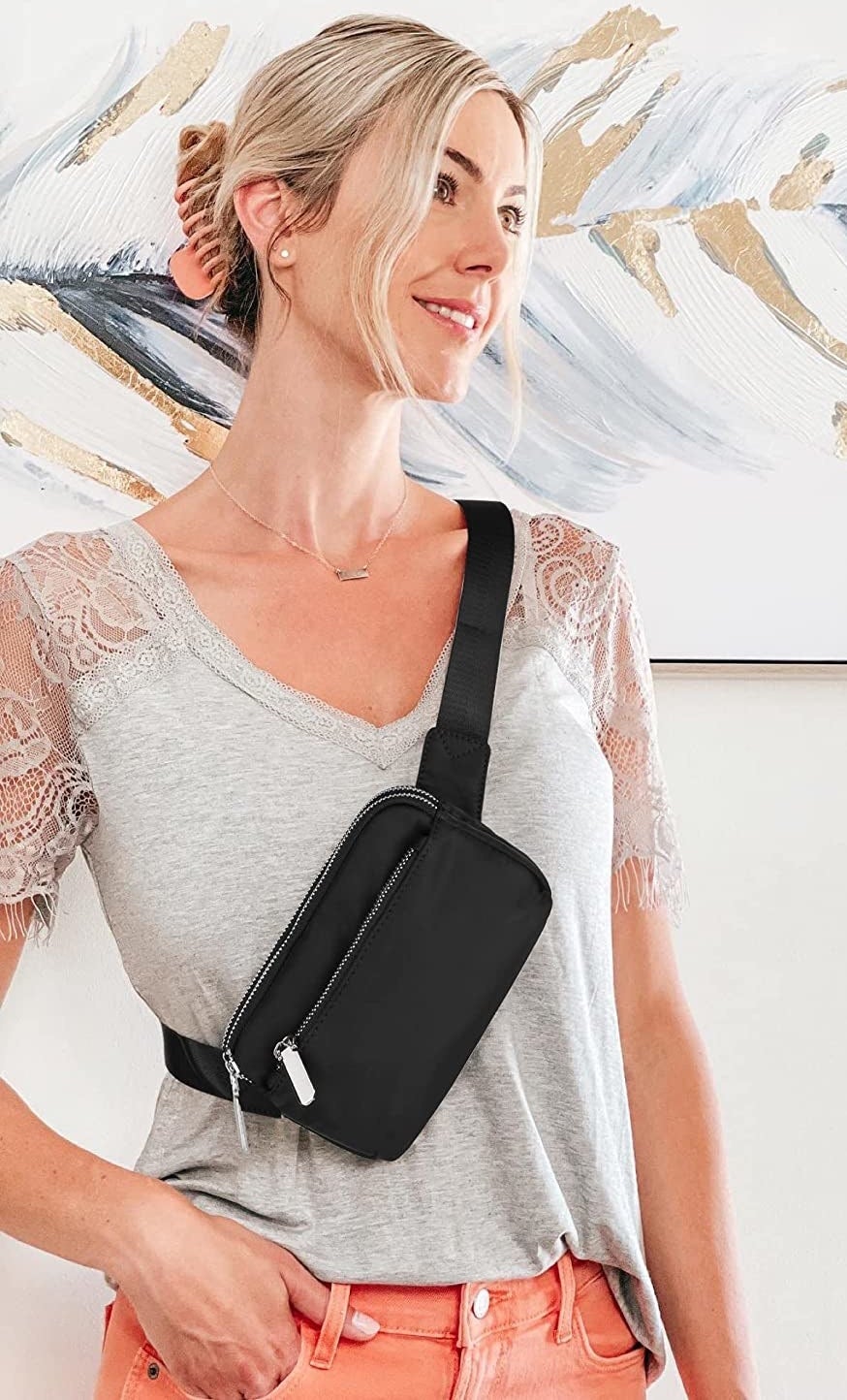 A person wearing the belt bag as a crossbody bag