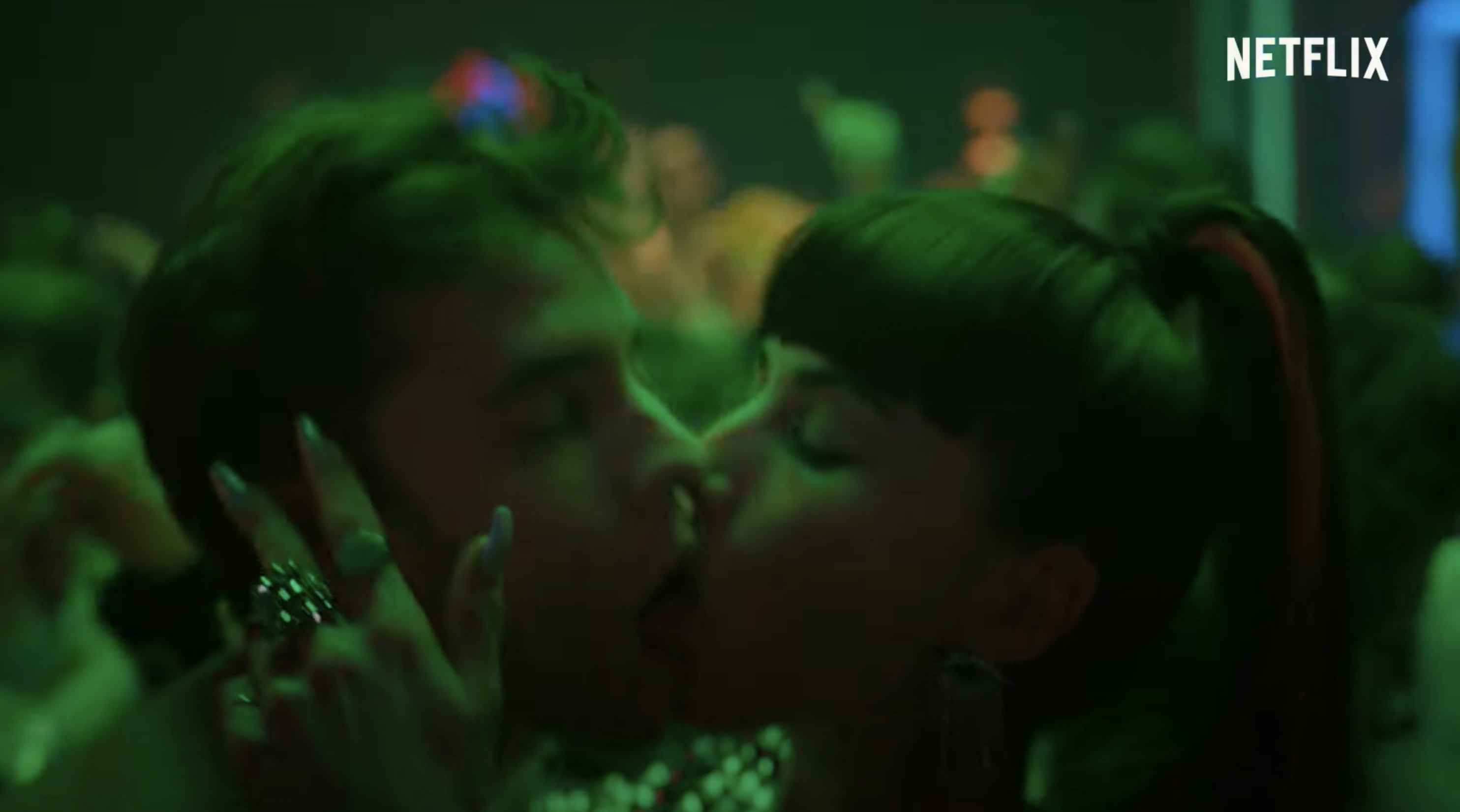 Rebe kissing a guy at a club