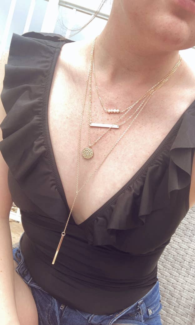 A reviewer wearing the jewelry