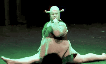 A burlesque Shrek does the splits and provocatively puts his finger in his mouth