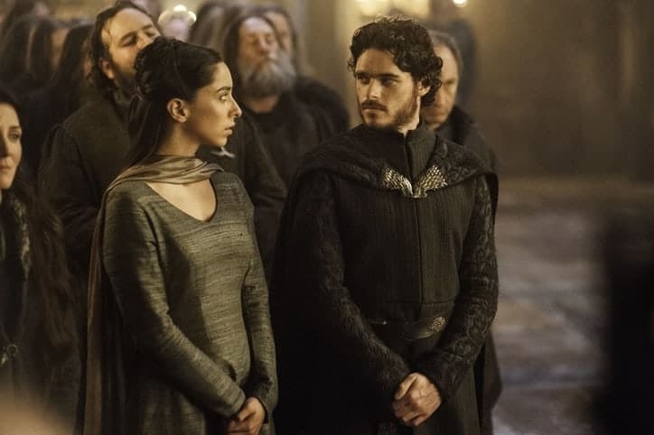 Oona Castilla Chaplin as Talisa Maegyr and Richard Madden as Robb Stark looking into each others eyes at The Red Wedding