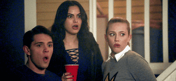 Lili Reinhart as Betty, Camila Mendes as Veronica, and Casey Cott as Kevin looking shocked on &quot;Riverdale&quot;