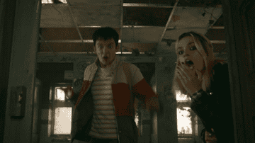 Asa Butterfield as Otis and Emma Mackey as Maeve looking shocked in &quot;Sex Education&quot;