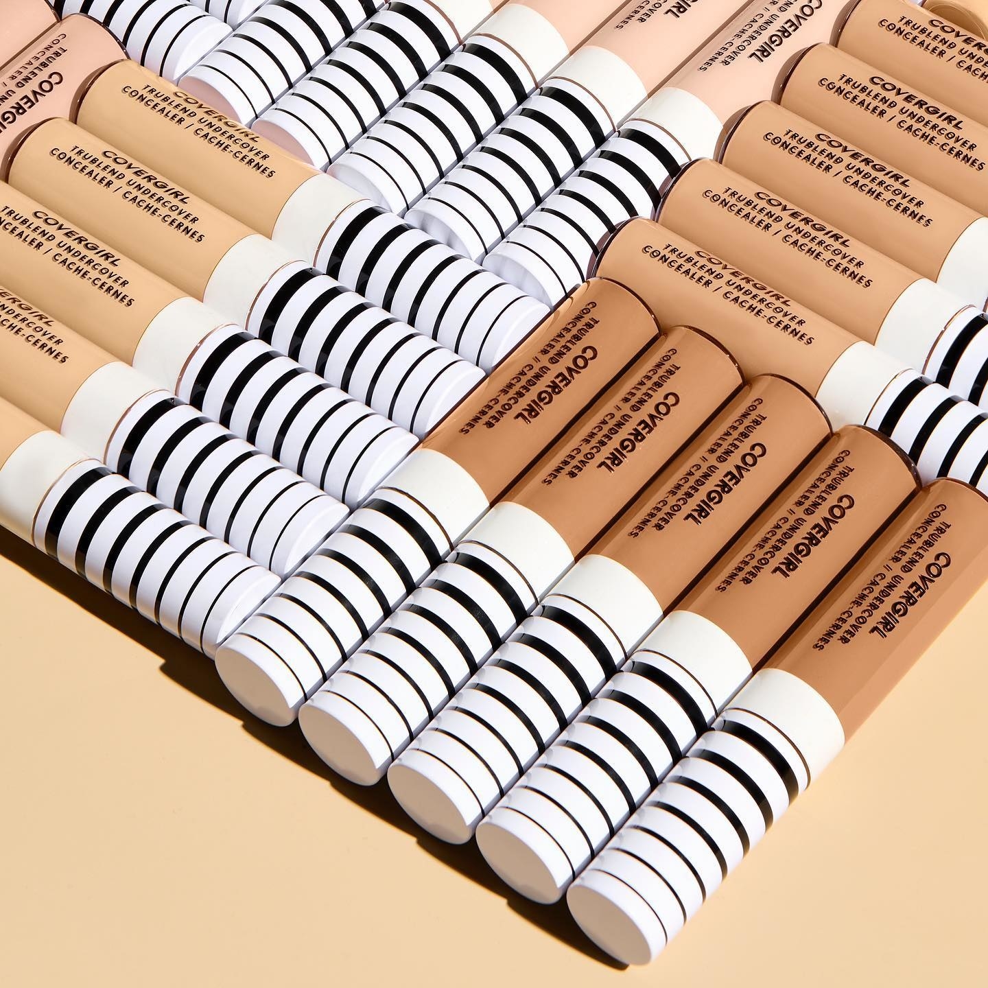 A clear and black and white tube of concealer