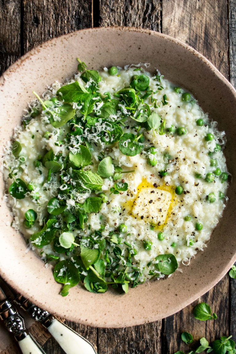A bowl of spring pea risotto with butter