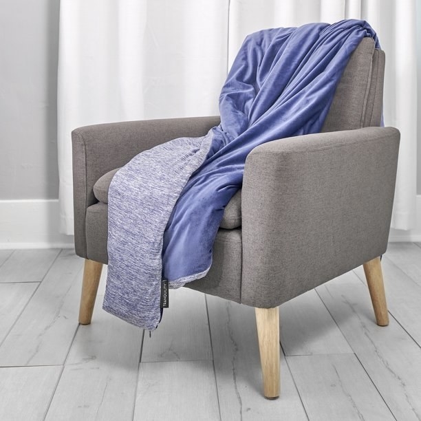 Blue weighted blanket on gray chair