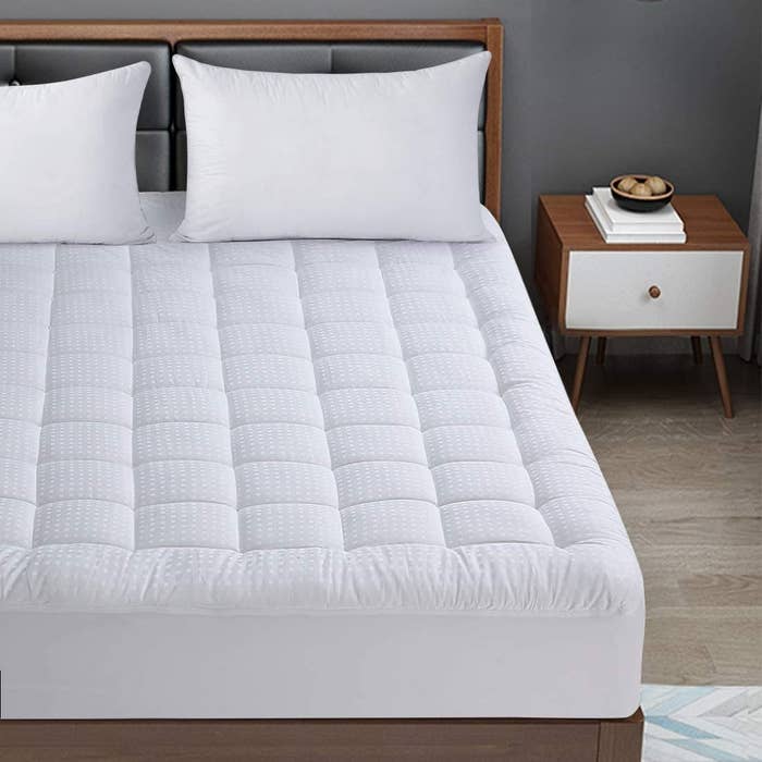 The mattress topper on a bed in a bedroom